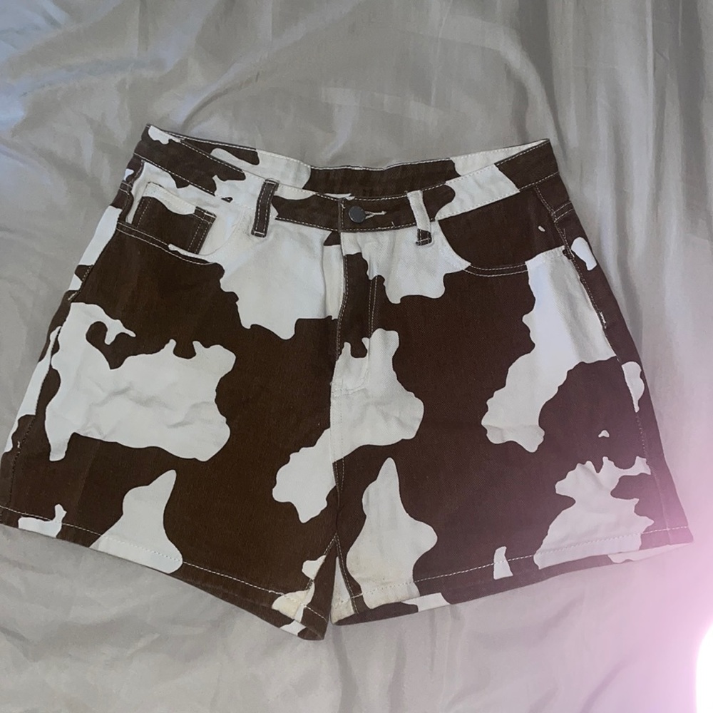 Brown and white cow print shorts